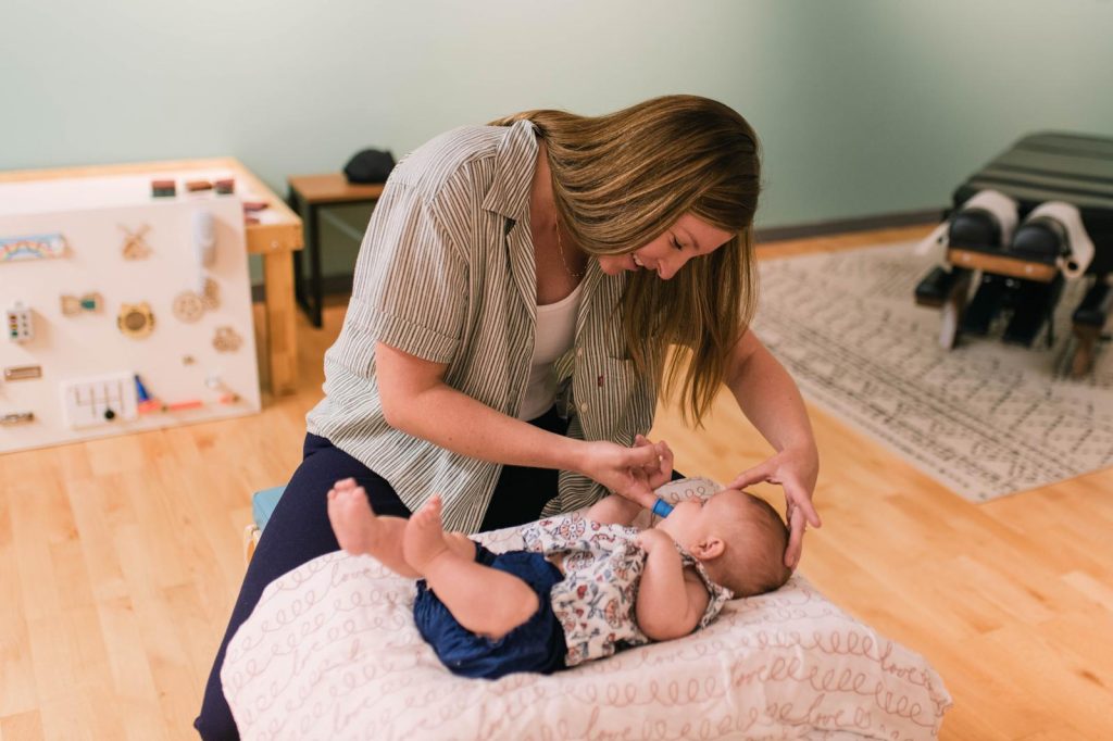 Baby supported with chiropractic wellness at Calmbody Chiropractic Club in Denver